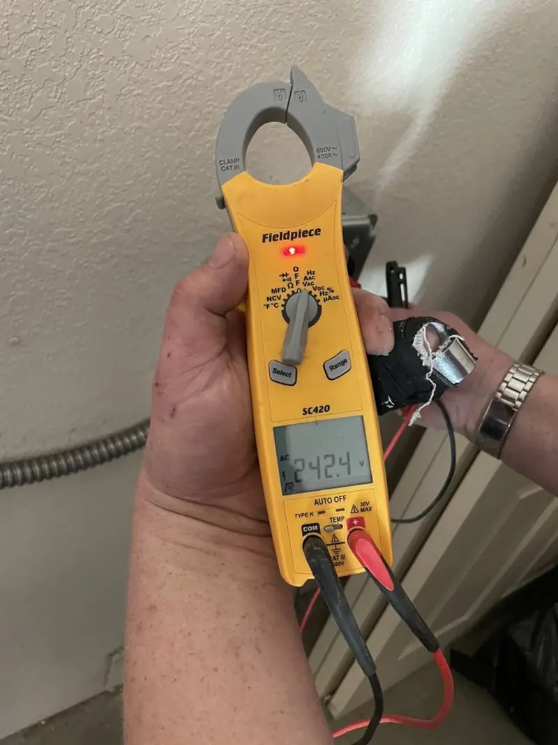 Voltage testing with clamp meter during Circuit Breaker Repair in Bryan